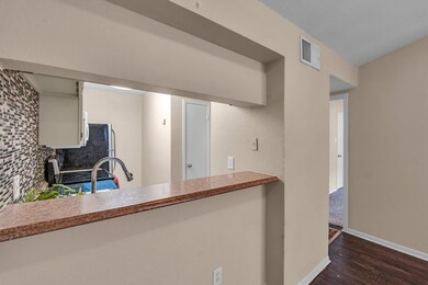 Kitchen featuring dark hardwood / wood-style floor