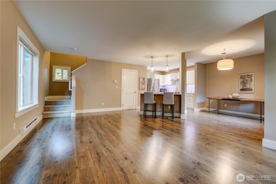 View of the living room and kitchen from entry