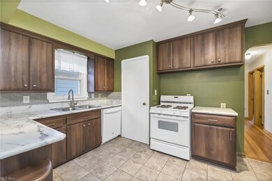Refaced cabinetry in kitchen and vinyl flooring.