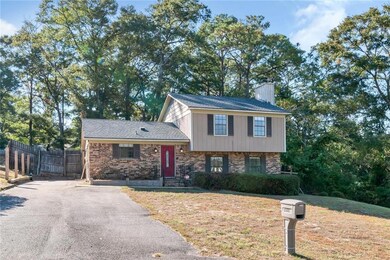 Split level home featuring a front lawn
