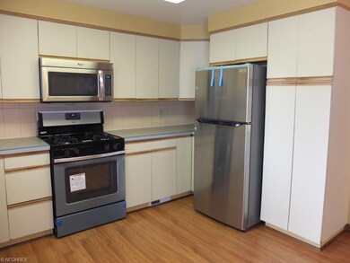 Fully applianced kitchen with pantry.