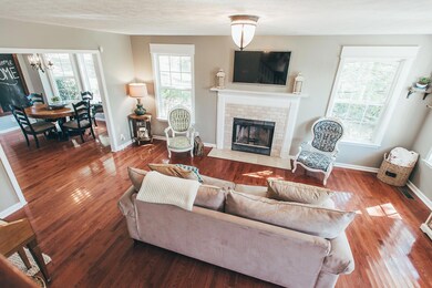 Beautiful hardwood floors and new paint greet you in this gorgeous living room!