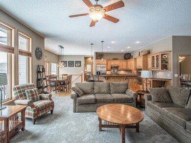 Living room opens up to kitchen and informal dinin