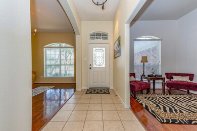 Entryway opens to an office space on the left and the formal dining room on the right.