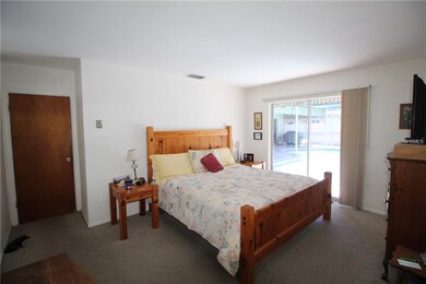 Spacious Master bedroom with sliders to pool deck