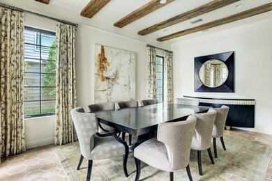 Jaw-dropping dining room creates the perfect setting for entertaining, yet remains open to the kitchen and patio. The home is wired for surround sound in this room as well as the pool area, living room and the entire primary suite.
