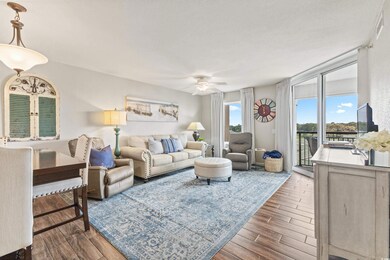 Living room with ceiling fan, dark wood-type floor