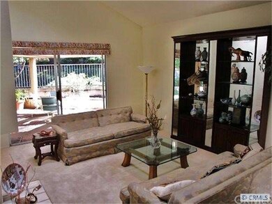 Living room with fireplace and slider to back yard
