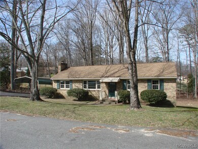Paved driveway and there's a rear entry near the c