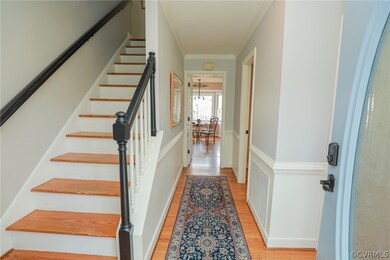 Inviting foyer with view of the wood staircase, ha