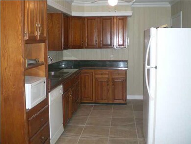 Kitchen view 1. Kitchen has new counter tops, sink