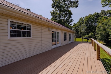Composite deck spans entire back of home and wraps