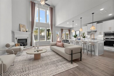 Upon entering, you’re greeted by an expansive living area that seamlessly connects to the gourmet kitchen and dining space, perfect for entertaining or family gatherings.