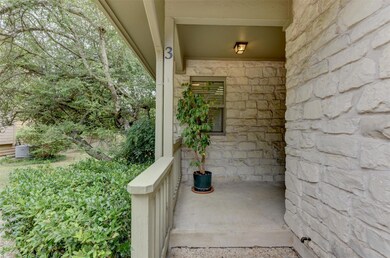 Doorway to property featuring covered porch and s