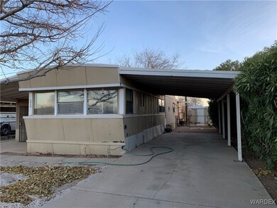 View of home's exterior with a carport