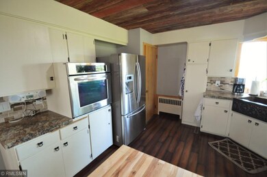 Great newer fridge, wall oven, and barn wood ceili