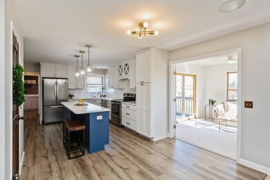 Informal dining space with French door entrance into the 4 season porch.