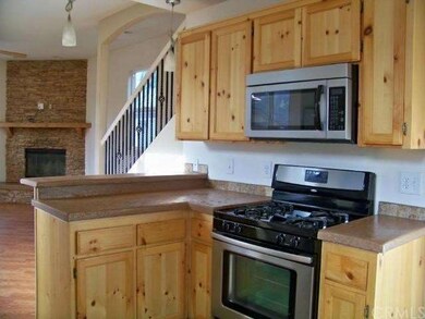Beautiful and many knotty pine cabinets and stainl
