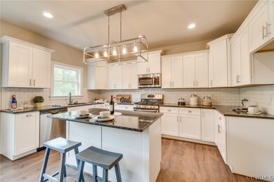 Example of Kitchen Cabinets, Granite, Ceramic Back