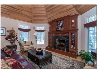 One of a Kind Hearth Room with Vaulted Wood Ceilin