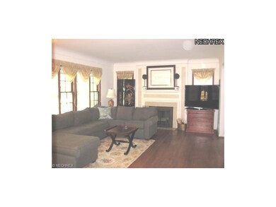 LIVING ROOM WITH FIREPLACE AND BUILT-IN BOOKCASE