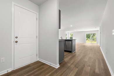 Hallway featuring dark hardwood / wood-style floor