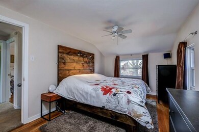 The master bedroom also features hardwood floors.