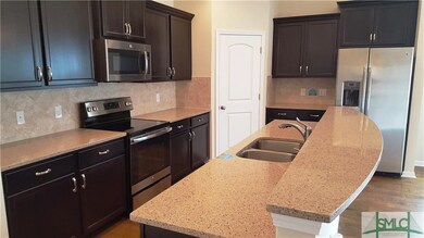 Great kitchen with Quartz Counter Tops and all app