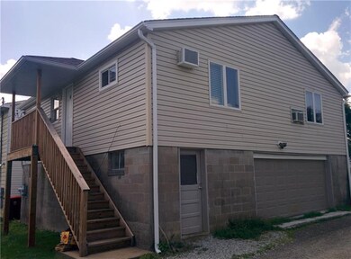 Rear Building - stairs up to 1BR Unit #4 (2-car ga