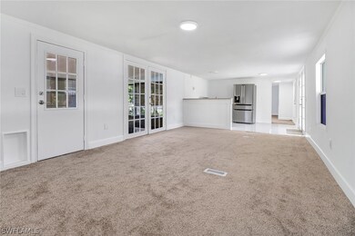 Unfurnished living room featuring a wealth of natu