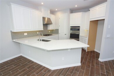 Check out this impressive kitchen & working island! There is plenty of room for food prep or gathering with friends and family!