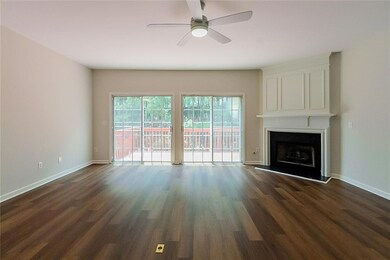Unfurnished living room featuring baseboards, ceil