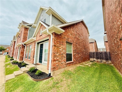 View of property exterior featuring fence, a lawn,