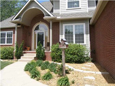 The landscaping creates a welcoming approach to th
