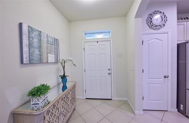 Entry way from the front door. Closet pantry to theright in the kitchen.