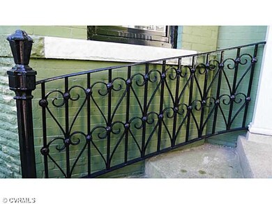 Facade/Exterior Front - The iron fencing and decorative railing set a wonderful tone as you come to the front entrance.