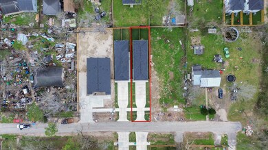 This duplex sits on a lot with a side yard and bac