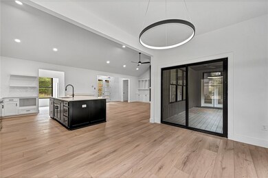Great view of the kitchen and living space from the dining area.