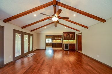Family room is open to kitchen and French doors to