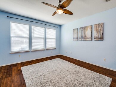 Family Room with Ceiling Fan, Three Large Windows 