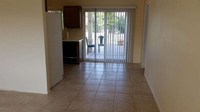 Tiled Dining Area w Patio Door