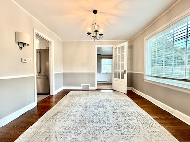 Oversized dining room with hardwood floors