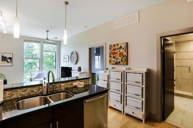Kitchen featuring a sink, stainless steel dishwas
