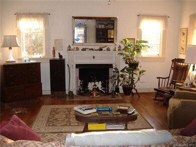 light-filled livingroom with fireplace