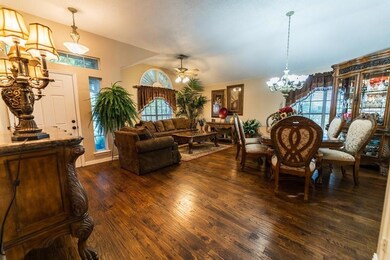View of first living room &  formal dining.