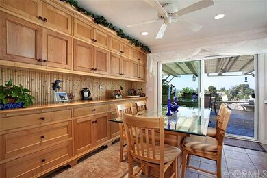 The dining room open to kitchen has beautiful buil
