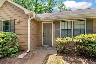 Property entrance with a shingled roof