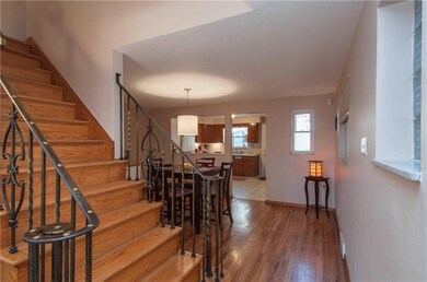 Open floor plan continues with view into kitchen a
