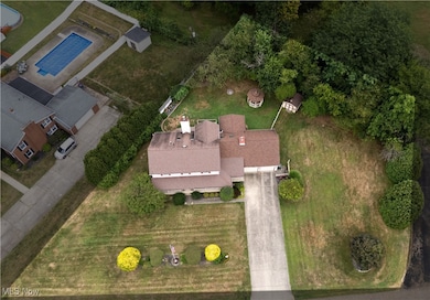 Drone view of parcel and home