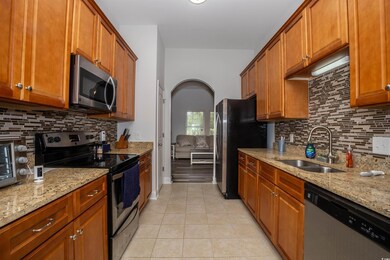 Kitchen with a sink, stainless steel appliances, l